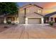 Charming two-story home with a three-car garage and well-maintained landscaping at 46065 W Meadows Ln, Maricopa, AZ 85139