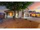 Charming two-story home with a three-car garage and xeriscaped front yard at 46065 W Meadows Ln, Maricopa, AZ 85139