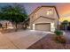 Charming two-story home with a three-car garage, enhanced by landscape lighting at 46065 W Meadows Ln, Maricopa, AZ 85139