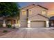 Charming two-story home with a three-car garage and well-maintained landscaping at 46065 W Meadows Ln, Maricopa, AZ 85139