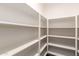 A walk in pantry with multiple shelves at 46065 W Meadows Ln, Maricopa, AZ 85139