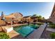 Backyard pool area with lounge chairs, a covered patio, and professional-grade pool cleaning equipment at 46065 W Meadows Ln, Maricopa, AZ 85139