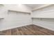 Walk-in closet featuring wood-look floors and wire shelving at 46065 W Meadows Ln, Maricopa, AZ 85139