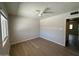 Bright bedroom with wood floors, a ceiling fan, and view into an adjacent room at 4701 N 68Th St # 105, Scottsdale, AZ 85251