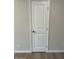 Interior door with a paneled design and a satin handle set against neutral-colored walls at 4701 N 68Th St # 105, Scottsdale, AZ 85251
