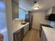 Updated kitchen with gray cabinets, stainless steel appliances, and quartz countertops at 4701 N 68Th St # 105, Scottsdale, AZ 85251