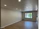 Bright, spacious living room with light wood floors and recessed lighting at 4701 N 68Th St # 105, Scottsdale, AZ 85251