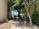 Charming walkway through lush greenery and mature trees at 4701 N 68Th St # 105, Scottsdale, AZ 85251