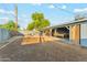 The spacious backyard includes an outdoor patio with a pool table and fence at 4726 W Indian School Rd, Phoenix, AZ 85031