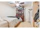 Comfortable bedroom features a ceiling fan, a bookshelf and closet at 4726 W Indian School Rd, Phoenix, AZ 85031