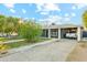 Single-story home with a carport, a front patio, and well-maintained lawn with decorative rocks at 4726 W Indian School Rd, Phoenix, AZ 85031