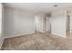 Spacious bedroom features neutral carpet, and ensuite bathroom at 5812 W Illini St, Phoenix, AZ 85043
