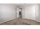 Bedroom features carpeted flooring and a closet with sliding doors at 5812 W Illini St, Phoenix, AZ 85043