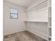 Walk-in closet features carpeted flooring and shelving at 5812 W Illini St, Phoenix, AZ 85043