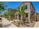 Charming two-story home with desert landscaping and a stone walkway at 5812 W Illini St, Phoenix, AZ 85043