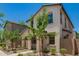 Charming two-story home with desert landscaping and an arched front entryway at 5812 W Illini St, Phoenix, AZ 85043