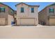 Charming two-story home with a neutral stucco exterior and a convenient two-car garage at 5812 W Illini St, Phoenix, AZ 85043