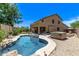 Spacious backyard with pool, spa, covered patio, and landscaped areas at 7031 W Lone Tree Trl, Peoria, AZ 85383