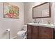 Bathroom with vanity, artwork, and toilet at 7031 W Lone Tree Trl, Peoria, AZ 85383