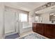 Bright bathroom featuring a tub, vanity with double sinks and shower at 7031 W Lone Tree Trl, Peoria, AZ 85383