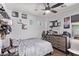 This is a bedroom with ceiling fan, and dresser at 7031 W Lone Tree Trl, Peoria, AZ 85383