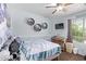 This bedroom features a ceiling fan and shelves at 7031 W Lone Tree Trl, Peoria, AZ 85383