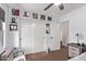 Bedroom with posters on the wall and closet with sliding doors at 7031 W Lone Tree Trl, Peoria, AZ 85383