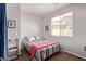 Cozy bedroom with a bright window and warm, neutral tones at 7031 W Lone Tree Trl, Peoria, AZ 85383
