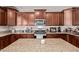Bright kitchen with granite countertops, stainless steel appliances, and island at 7031 W Lone Tree Trl, Peoria, AZ 85383