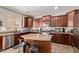 Well-lit kitchen with granite countertops, stainless steel appliances, and a center island at 7031 W Lone Tree Trl, Peoria, AZ 85383
