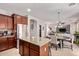 Bright eat-in kitchen featuring stainless steel appliances and bar-stool seating at 7031 W Lone Tree Trl, Peoria, AZ 85383