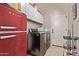 The laundry room has a washer and dryer and is well organized at 7031 W Lone Tree Trl, Peoria, AZ 85383