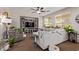 Bright living room featuring a large sectional sofa, media center, and indoor plants at 7031 W Lone Tree Trl, Peoria, AZ 85383