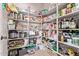 Walk-in pantry with ample shelving and storage space for groceries and kitchen items at 7031 W Lone Tree Trl, Peoria, AZ 85383