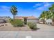 Charming single-story home with desert landscaping, mature trees, and a two-car garage at 7526 W Cheryl Dr, Peoria, AZ 85345