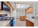 Bright kitchen featuring white countertops, wood cabinets, and a spacious tile floor for easy cleanup at 7526 W Cheryl Dr, Peoria, AZ 85345