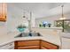 The kitchen sink offers plenty of counter space and a view into the neighboring living room at 7526 W Cheryl Dr, Peoria, AZ 85345