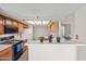 Charming kitchen with light-colored cabinets, white countertops, and a tile floor that is easy to clean at 7526 W Cheryl Dr, Peoria, AZ 85345