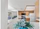 Bright kitchen with white countertops, wood cabinets, and an open view into the backyard at 7526 W Cheryl Dr, Peoria, AZ 85345