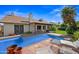 Sparkling pool with lounge chairs and brick patio, perfect for outdoor relaxation at 7526 W Cheryl Dr, Peoria, AZ 85345