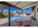 Covered patio overlooking pool, great for outdoor dining and entertaining guests at 7526 W Cheryl Dr, Peoria, AZ 85345