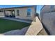 Backyard showcases a paver path and artificial turf extending from the covered patio to the side yard at 7925 S 24Th Way, Phoenix, AZ 85042