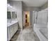 Well-appointed bathroom features double sinks, soaking tub, and separate glass-enclosed shower at 7925 S 24Th Way, Phoenix, AZ 85042
