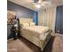Cozy primary bedroom with a comfortable bed, soft carpet, and stylish decor at 7925 S 24Th Way, Phoenix, AZ 85042
