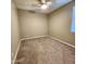 Neutral-colored bedroom with carpeted floors, a window, and a ceiling fan at 7925 S 24Th Way, Phoenix, AZ 85042