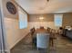Bright dining area features a large wooden table and stylish light fixture, perfect for Gathering meals at 7925 S 24Th Way, Phoenix, AZ 85042