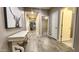 Welcoming foyer with tile floors, decorative table, and art in neutral color palette at 7925 S 24Th Way, Phoenix, AZ 85042