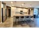 Bright, open kitchen with a granite island, stainless appliances, and a breakfast bar at 7925 S 24Th Way, Phoenix, AZ 85042