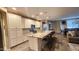 Bright kitchen with granite counters, stainless appliances, and pendant lighting over the island at 7925 S 24Th Way, Phoenix, AZ 85042