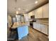 Modern kitchen with stainless steel appliances, granite counters, and a spacious center island at 7925 S 24Th Way, Phoenix, AZ 85042